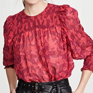 Pink smocked silk yoke blouse with a soft floral print